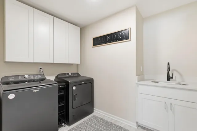 a view of a kitchen with sink and cabinets