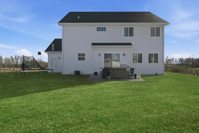a front view of house with garden