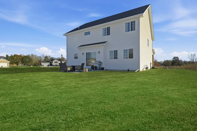 a front view of house with garden