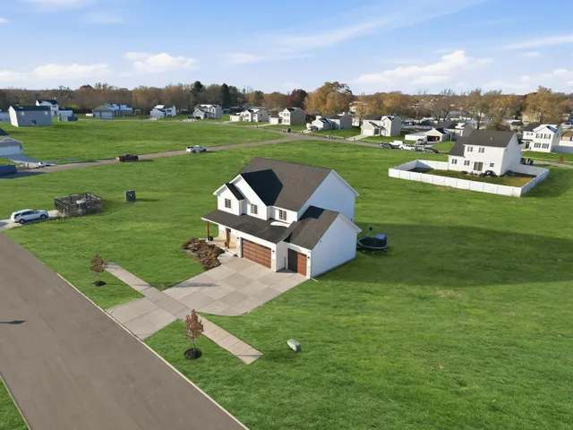 a view of a garden with lawn chairs
