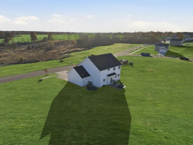 a view of a lake with a yard