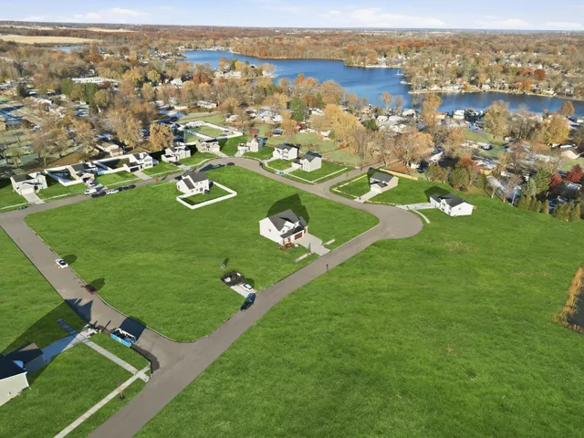 a view of a lake with a yard