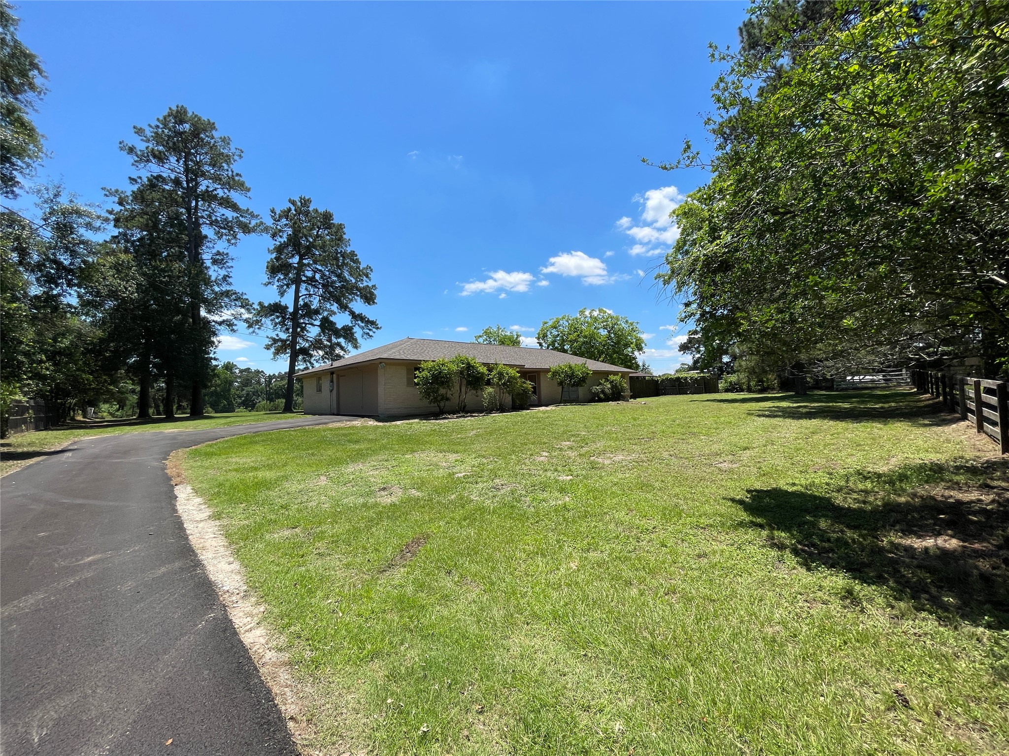 19439 Keenan Cut Off Road Montgomery, TX 77316 - Photo 4 of 39 A single-story home in a serene, private setting.