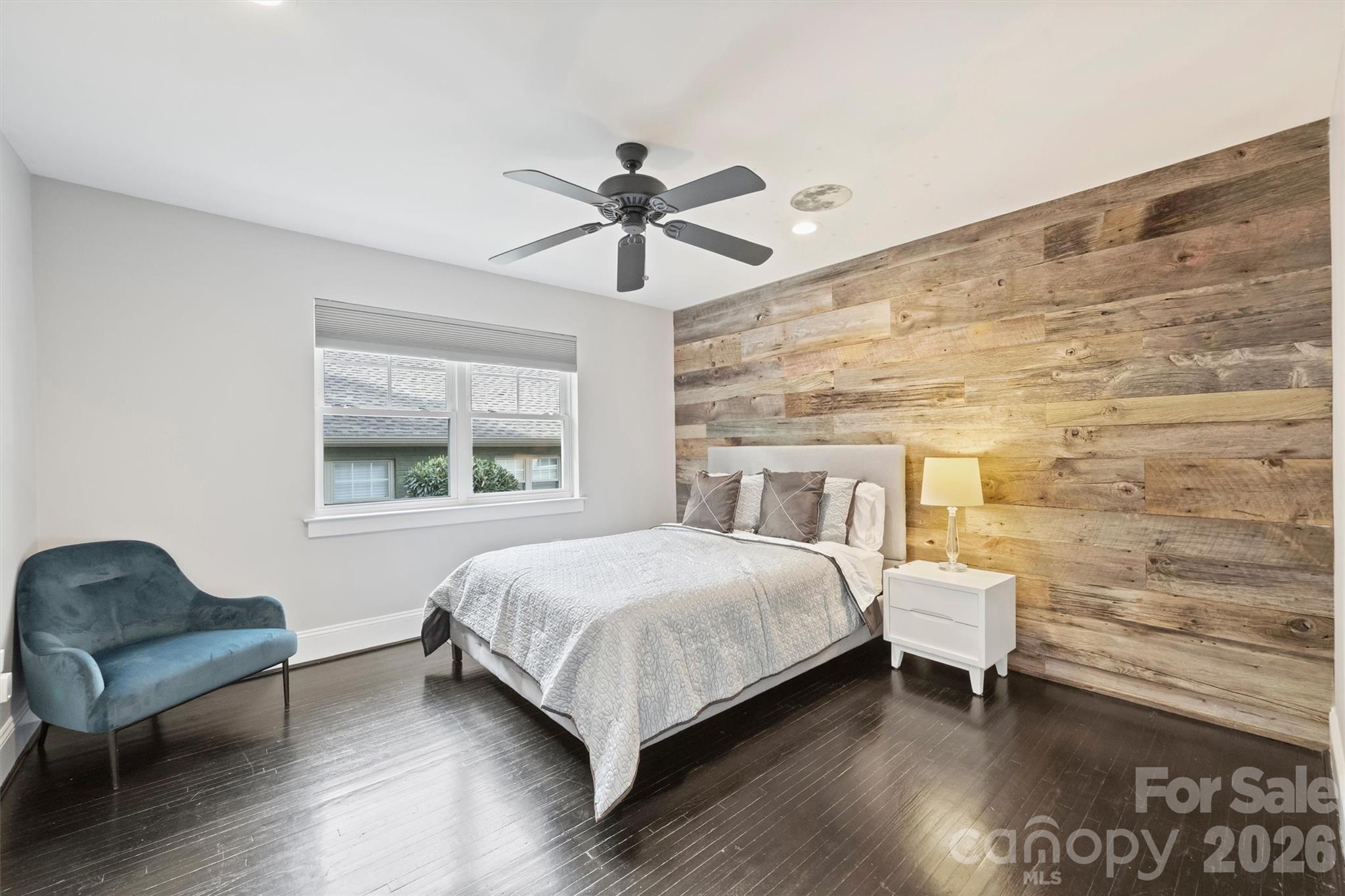 1734 Club Road Charlotte, NC 28205 - Photo 16 of 41 a bedroom with a bed and a chair