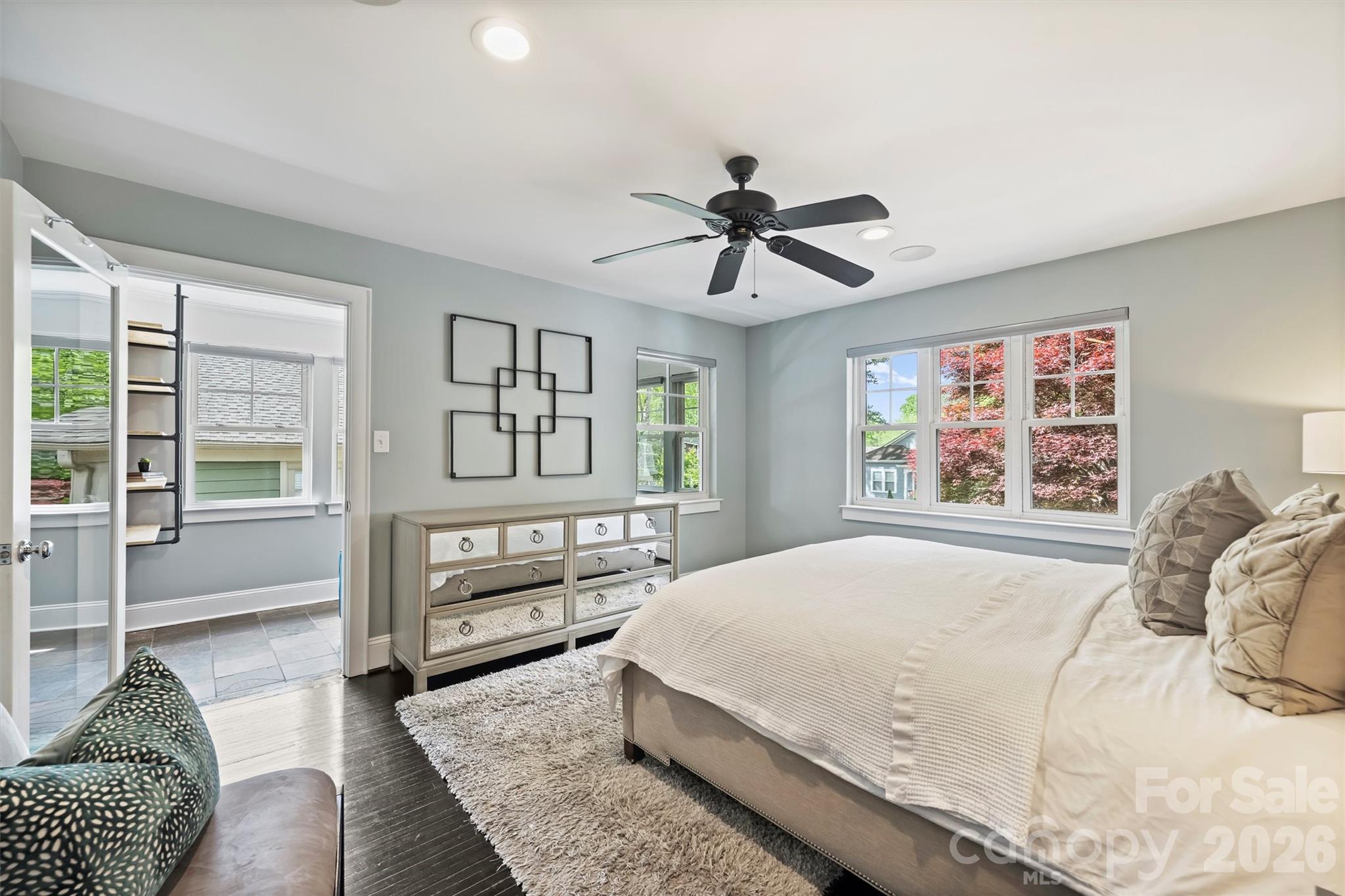 1734 Club Road Charlotte, NC 28205 - Photo 18 of 41 a spacious bedroom with a large bed a chandelier and windows
