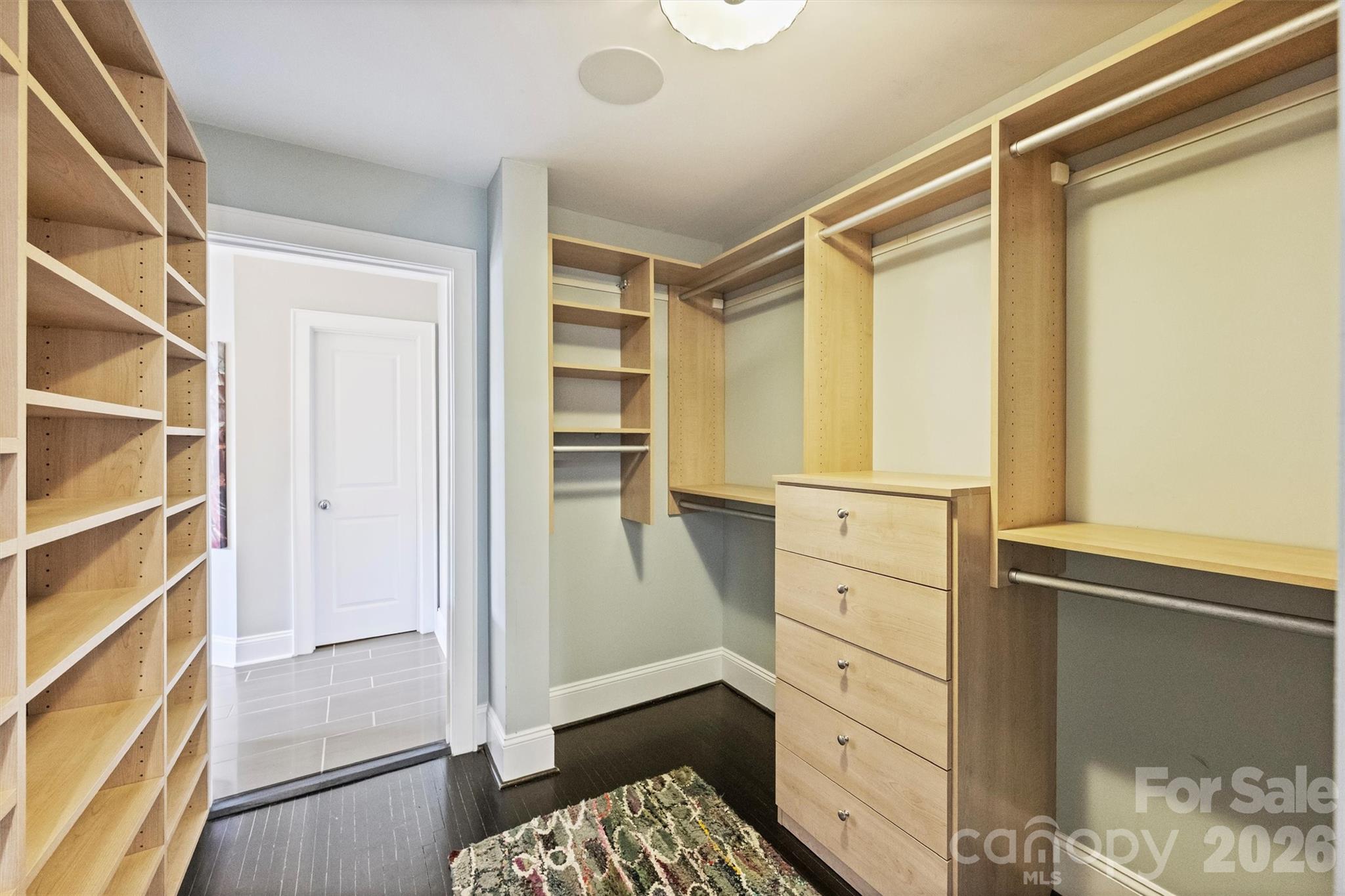 1734 Club Road Charlotte, NC 28205 - Photo 23 of 41 a view of walk in closet with empty racks
