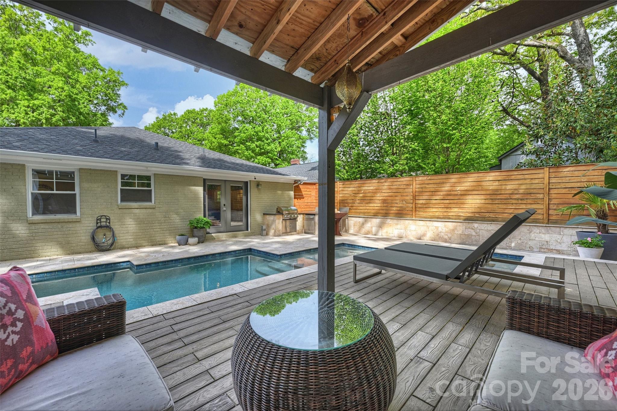 1734 Club Road Charlotte, NC 28205 - Photo 30 of 41 a view of a patio with couches chairs and wooden floor