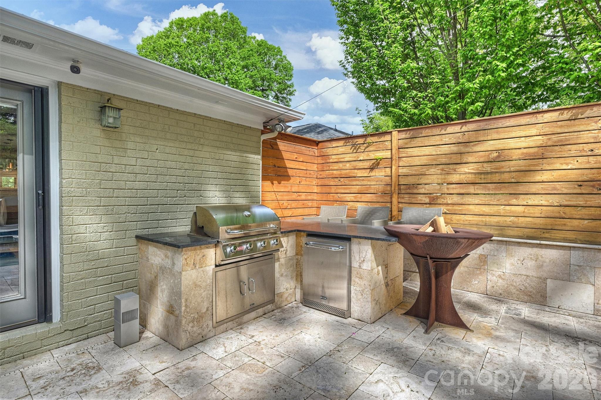 1734 Club Road Charlotte, NC 28205 - Photo 35 of 41 a view of a patio with table and chairs with an outdoor space