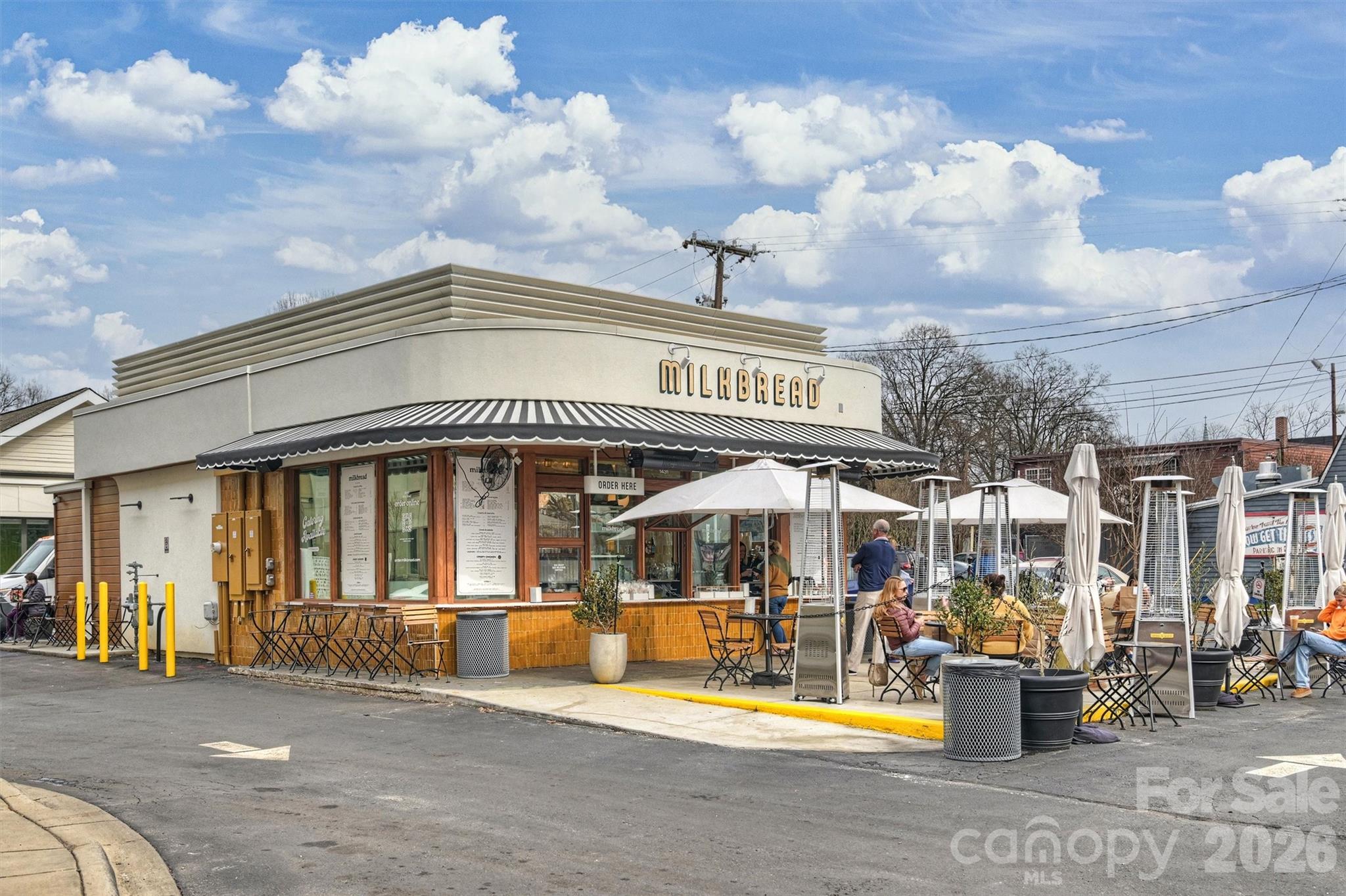 1734 Club Road Charlotte, NC 28205 - Photo 37 of 41 a front view of a building with sitting area