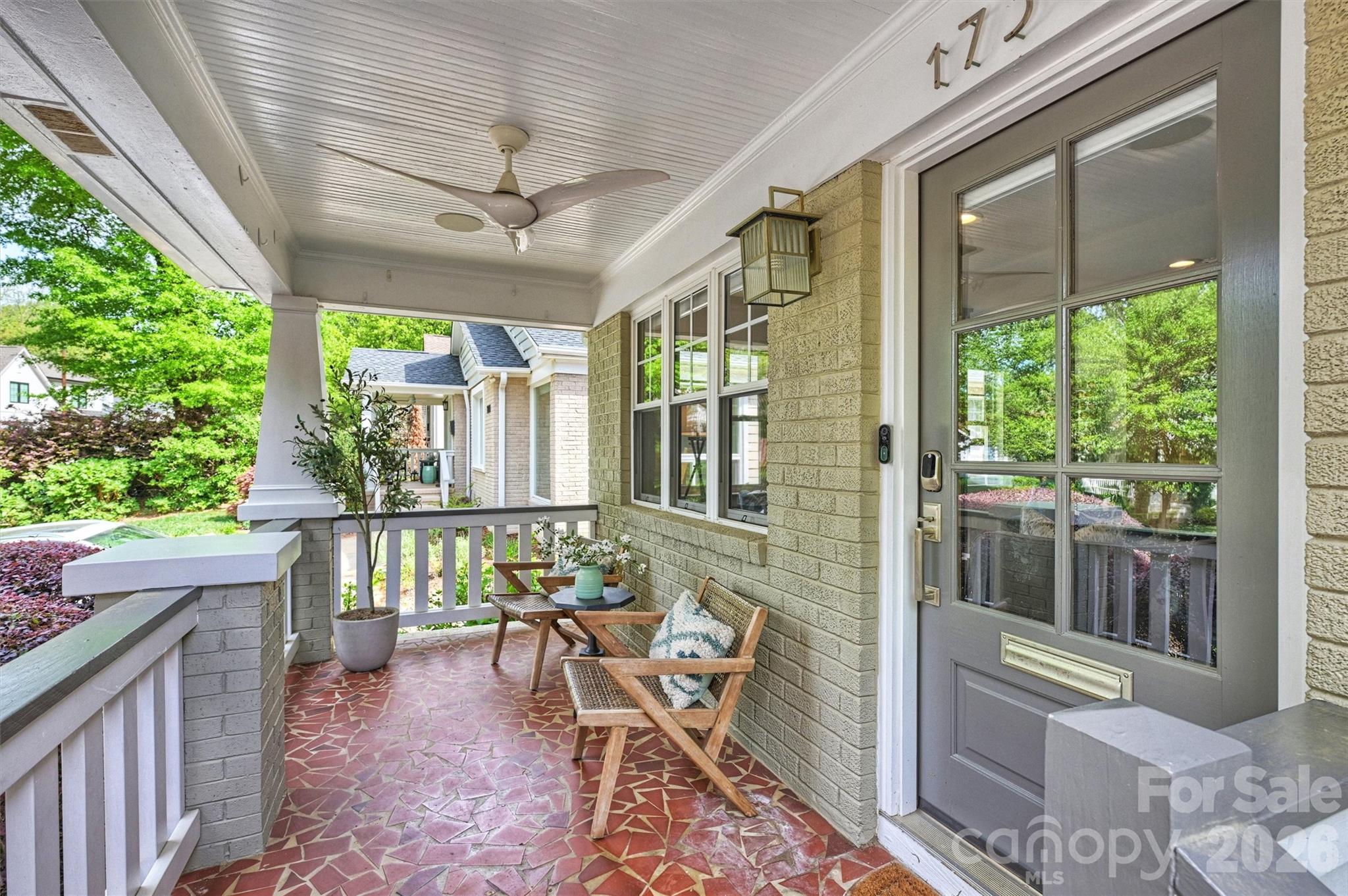 1734 Club Road Charlotte, NC 28205 - Photo 4 of 41 a balcony with furniture and large windows