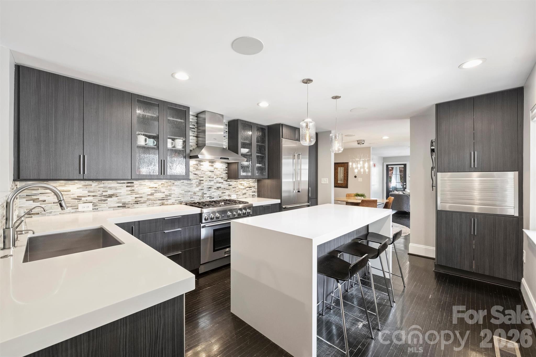 1734 Club Road Charlotte, NC 28205 - Photo 9 of 41 a kitchen with a sink a stove a refrigerator and a stove