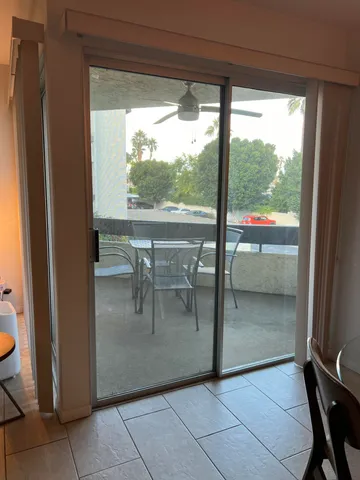 a view of a living room and floor to ceiling window