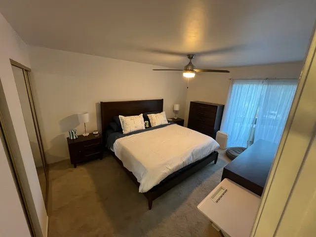 a bedroom with a bed and a walk in closet