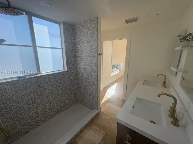 a bathroom with a sink and a bathtub