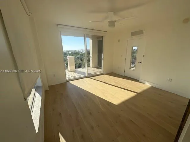 a view of an empty room and window