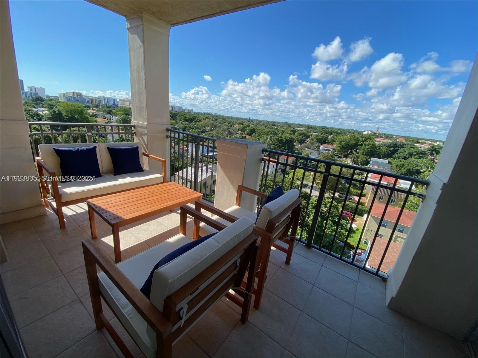 2650 Southwest 37th Avenue, Unit 807 Miami, FL 33134 - Photo 7 of 15 a view of a balcony with furniture