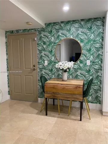 a outdoor seating area with a table and chair