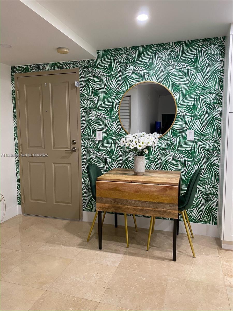 2650 Southwest 37th Avenue, Unit 807 Miami, FL 33134 - Photo 8 of 15 a outdoor seating area with a table and chair