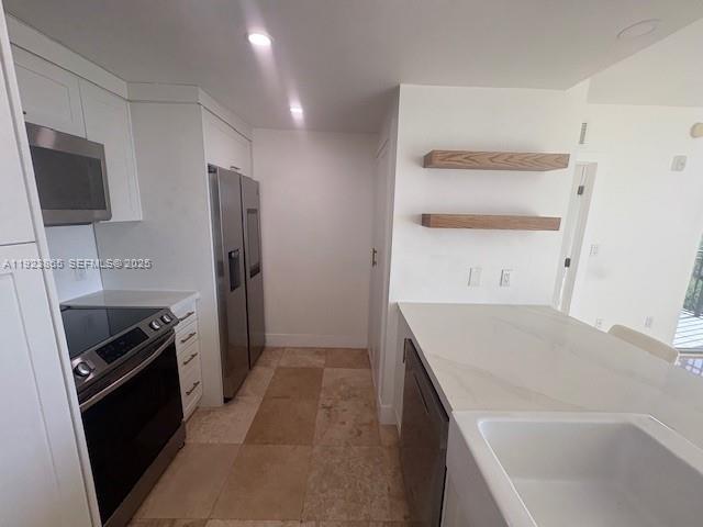 2650 Southwest 37th Avenue, Unit 807 Miami, FL 33134 - Photo 10 of 15 a kitchen with a sink stove and refrigerator