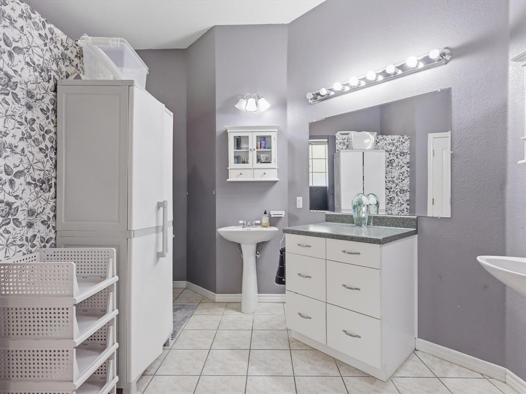 130 Parsonage Street Azle, TX 76020 - Photo 12 of 39 Full bathroom with baseboards and light tile patterned flooring