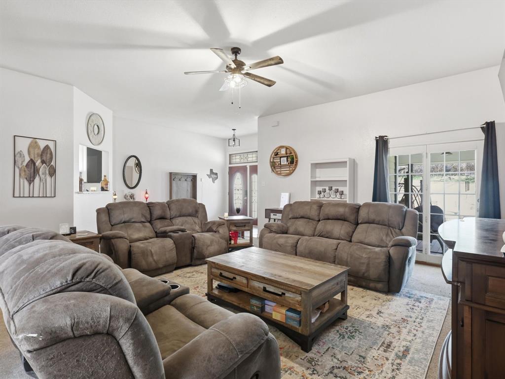 130 Parsonage Street Azle, TX 76020 - Photo 16 of 39 Living area with plenty of natural light and ceiling fan