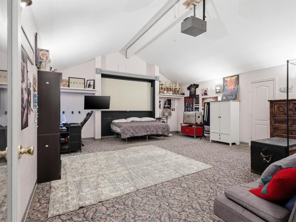 130 Parsonage Street Azle, TX 76020 - Photo 20 of 39 Bedroom featuring beam ceiling, a desk, and carpet flooring