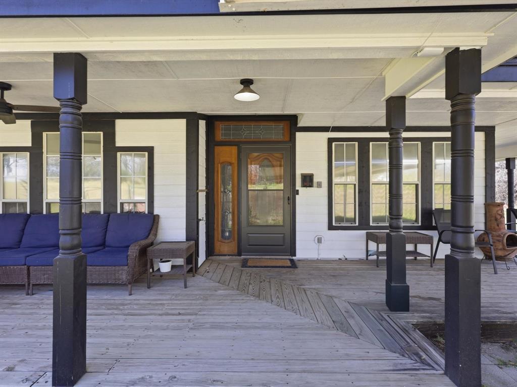 130 Parsonage Street Azle, TX 76020 - Photo 2 of 39 View of exterior entry with outdoor lounge area and covered porch