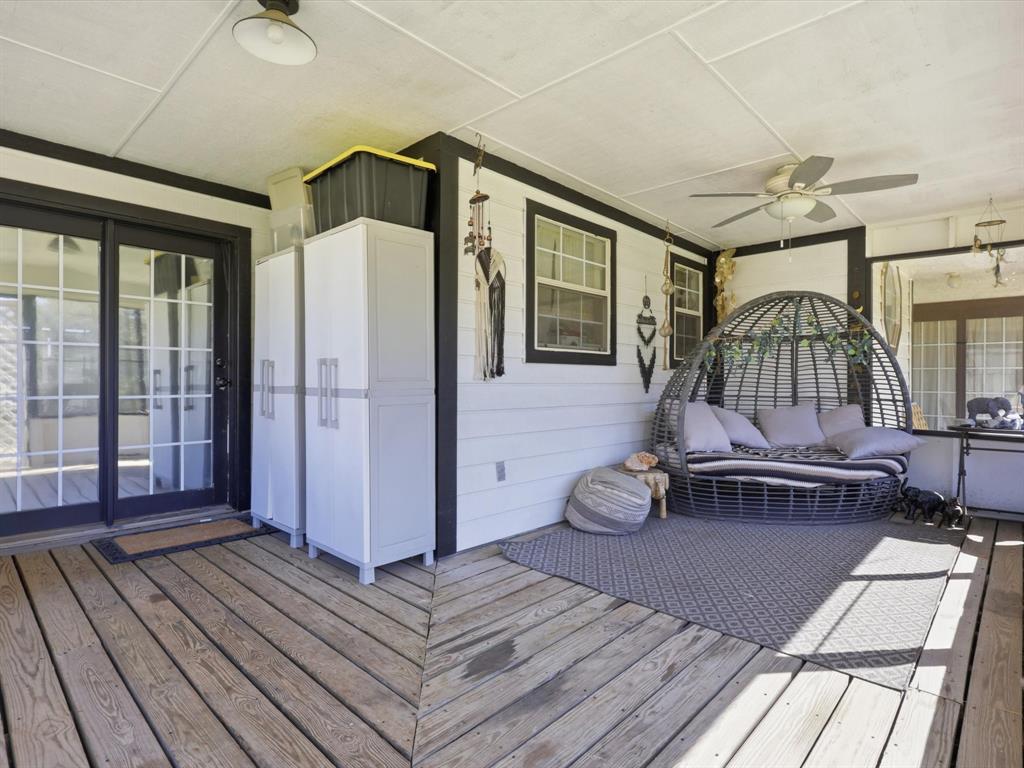 130 Parsonage Street Azle, TX 76020 - Photo 4 of 39 Wooden terrace featuring a ceiling fan