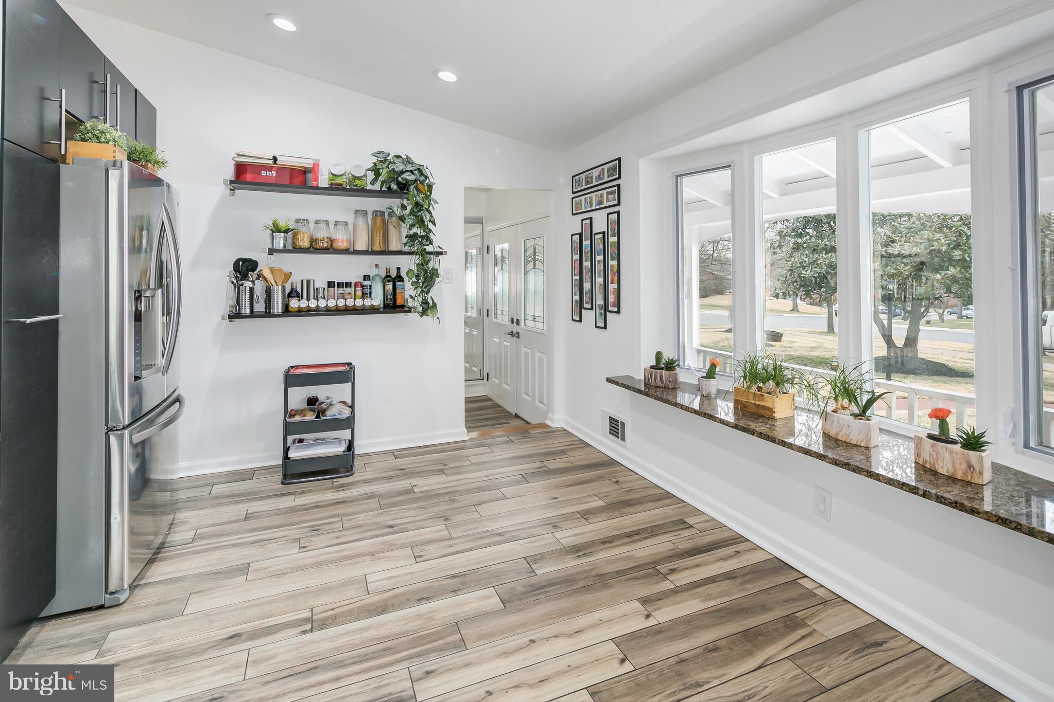 136 Claybrook Drive Silver Spring, MD 20902 - Photo 12 of 30 a kitchen with stainless steel appliances a refrigerator and a sink
