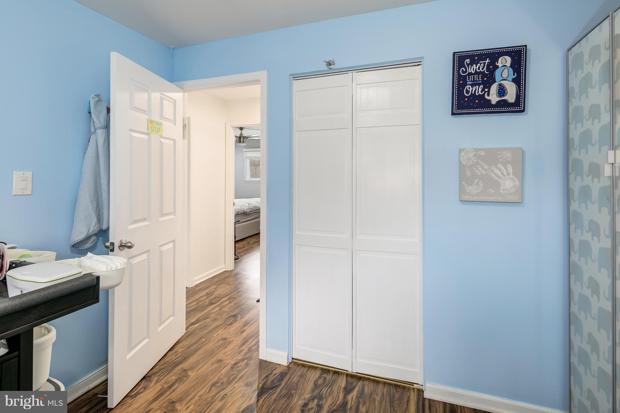 136 Claybrook Drive Silver Spring, MD 20902 - Photo 15 of 30 a view of a hallway with wooden floor and cabinet