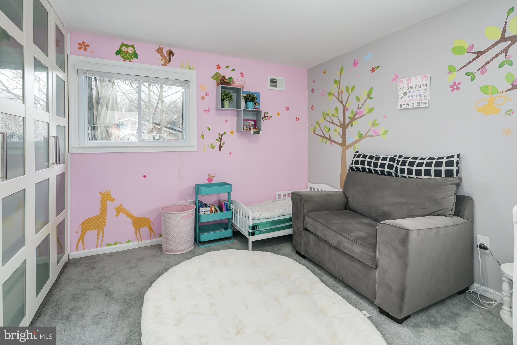 136 Claybrook Drive Silver Spring, MD 20902 - Photo 17 of 30 a living room with furniture and a wooden floor