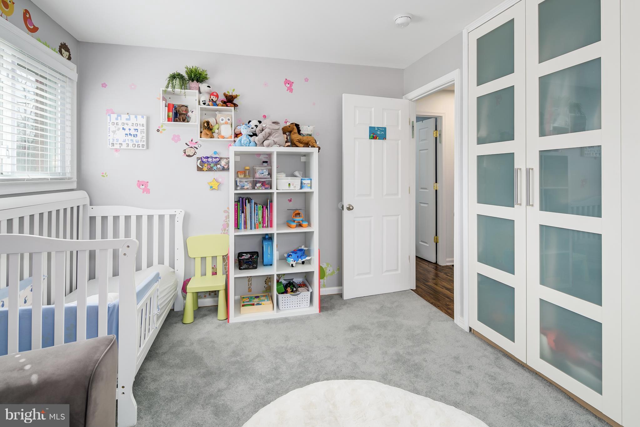 136 Claybrook Drive Silver Spring, MD 20902 - Photo 18 of 30 a bedroom with furniture and baby crib