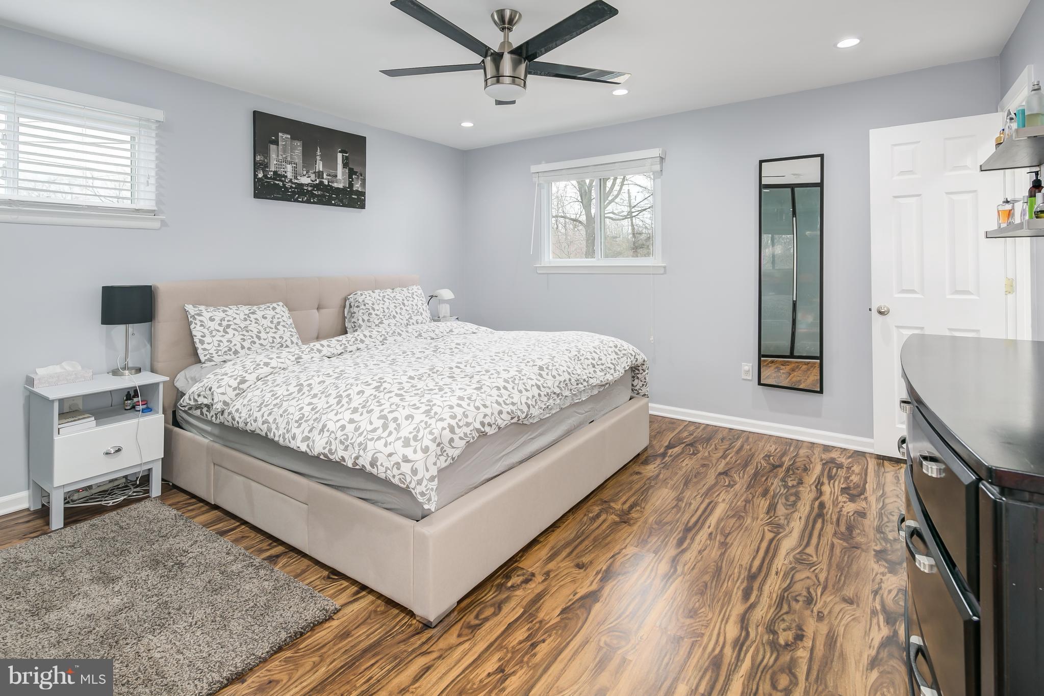 136 Claybrook Drive Silver Spring, MD 20902 - Photo 19 of 30 a bedroom with a bed and a table in it
