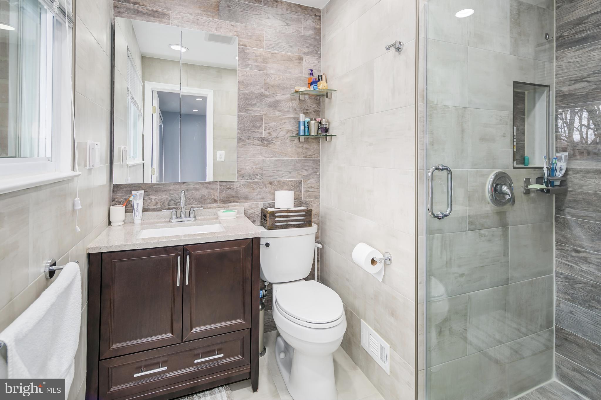 136 Claybrook Drive Silver Spring, MD 20902 - Photo 21 of 30 a bathroom with a sink toilet and shower