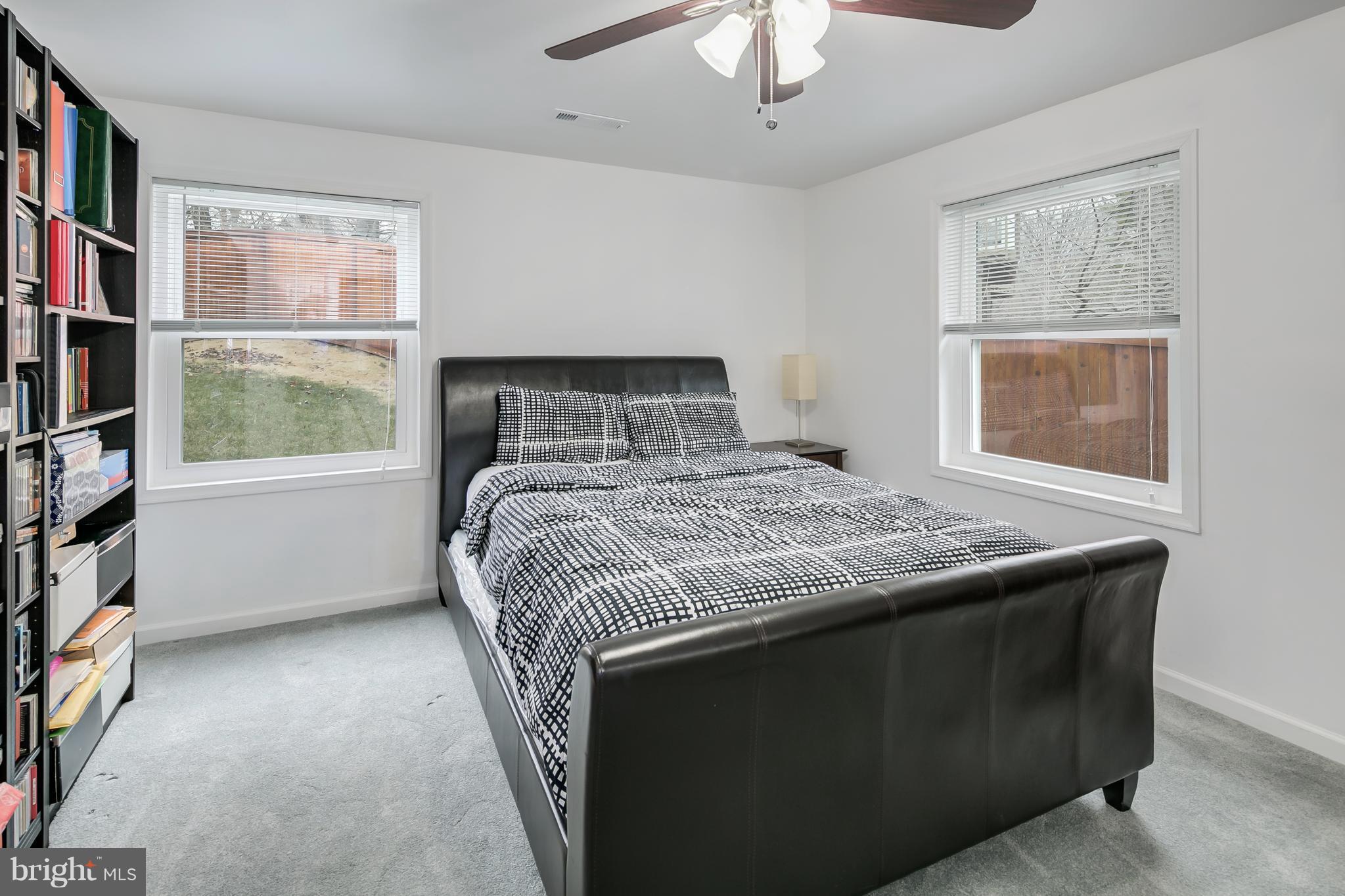 136 Claybrook Drive Silver Spring, MD 20902 - Photo 25 of 30 a bedroom with a bed furniture and a window