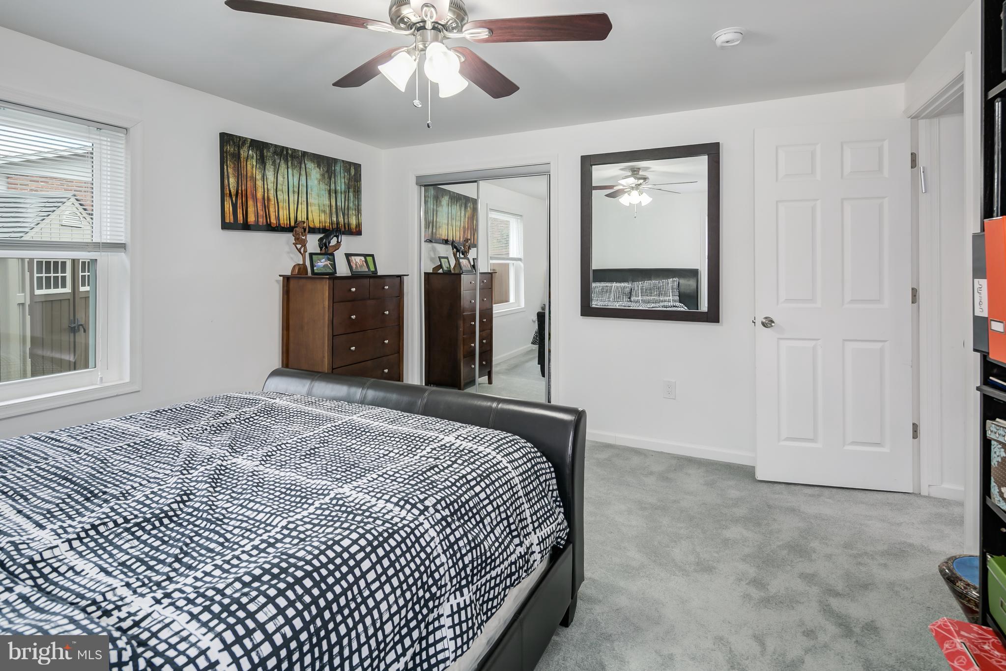 136 Claybrook Drive Silver Spring, MD 20902 - Photo 26 of 30 a bedroom with a bed and a dresser