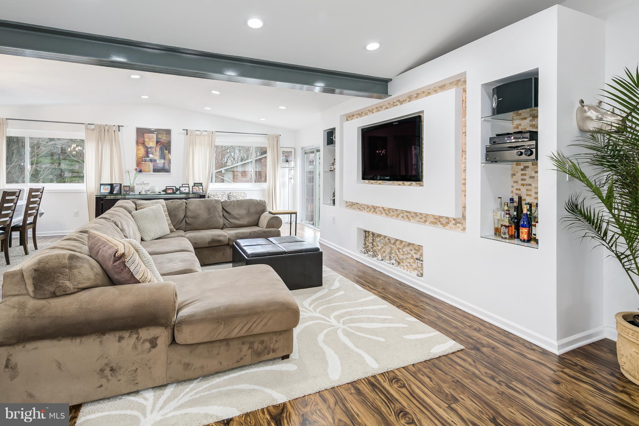 136 Claybrook Drive Silver Spring, MD 20902 - Photo 4 of 30 a living room with furniture and a flat screen tv