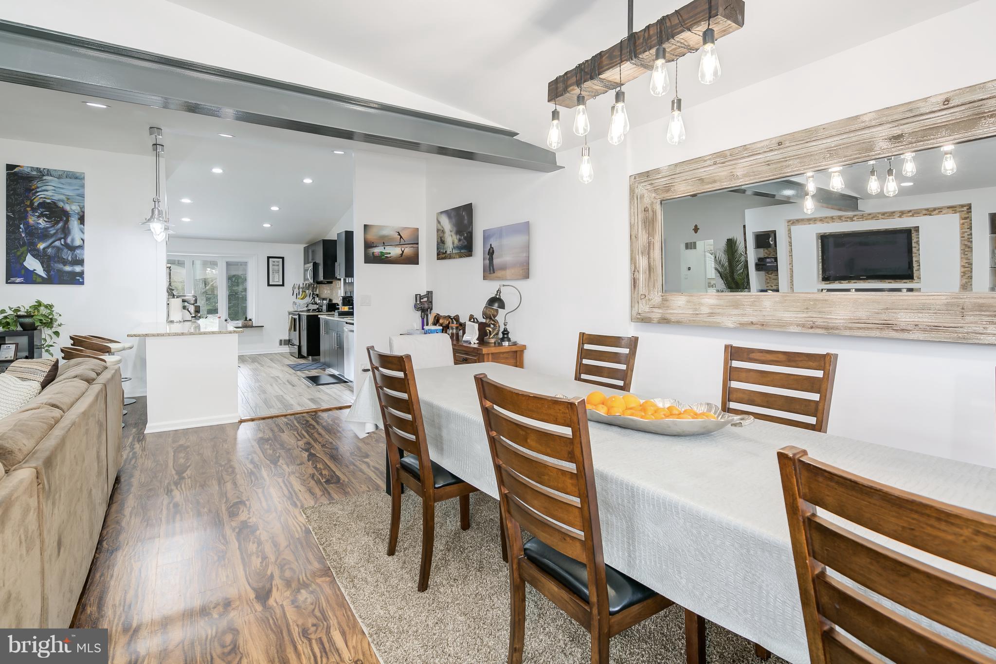 136 Claybrook Drive Silver Spring, MD 20902 - Photo 7 of 30 a living room with stainless steel appliances kitchen island granite countertop furniture and a kitchen view