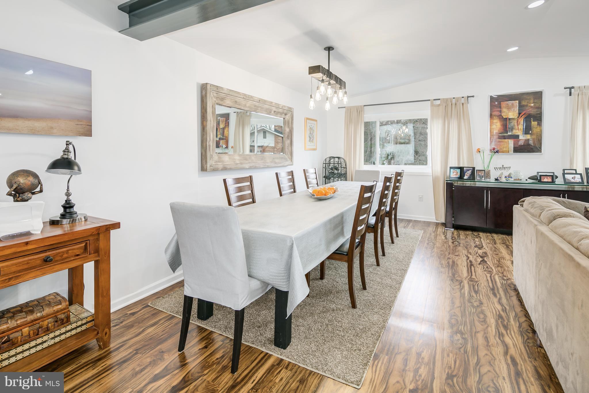 136 Claybrook Drive Silver Spring, MD 20902 - Photo 8 of 30 a view of a dining room with furniture window and wooden floor