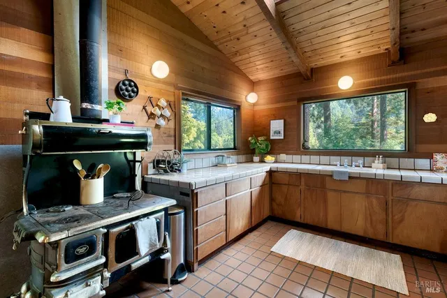 a kitchen with a stove and a sink