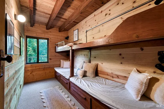 a bedroom with furniture and a window