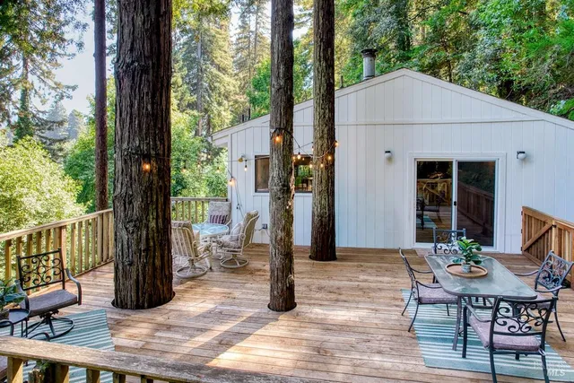 a house view with a sitting space and garden space