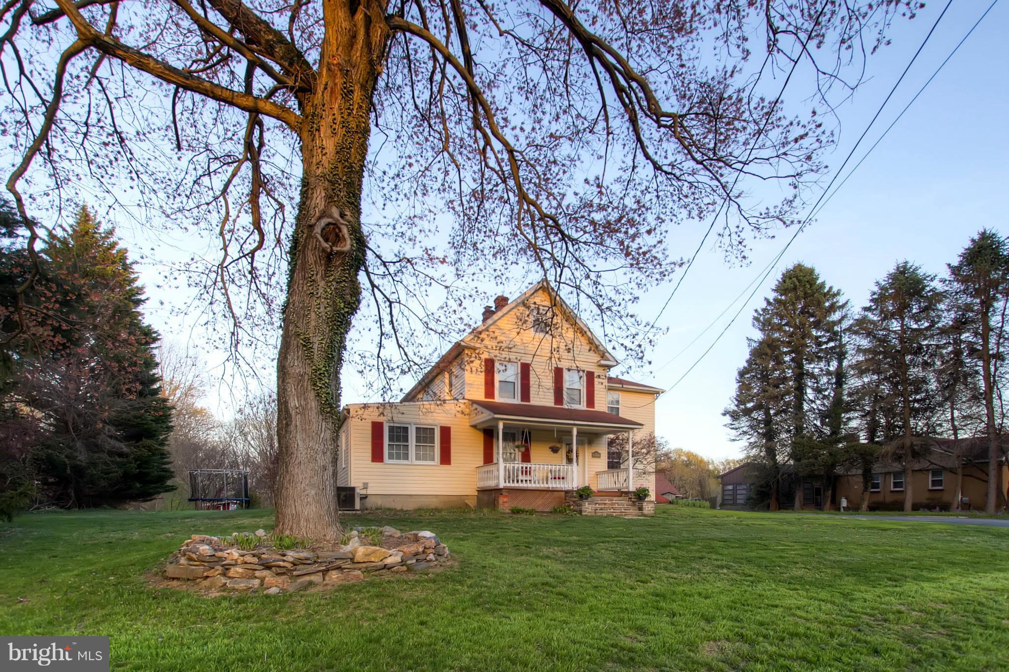 2911 Ridge Road Baltimore, MD 21244 - Photo 3 of 23 a front view of a house with a garden
