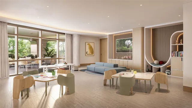 a living room with furniture and large windows