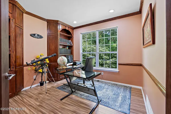 a work room with furniture and wooden floor