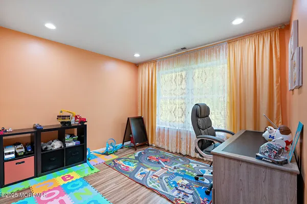 a room with furniture and a wooden floor