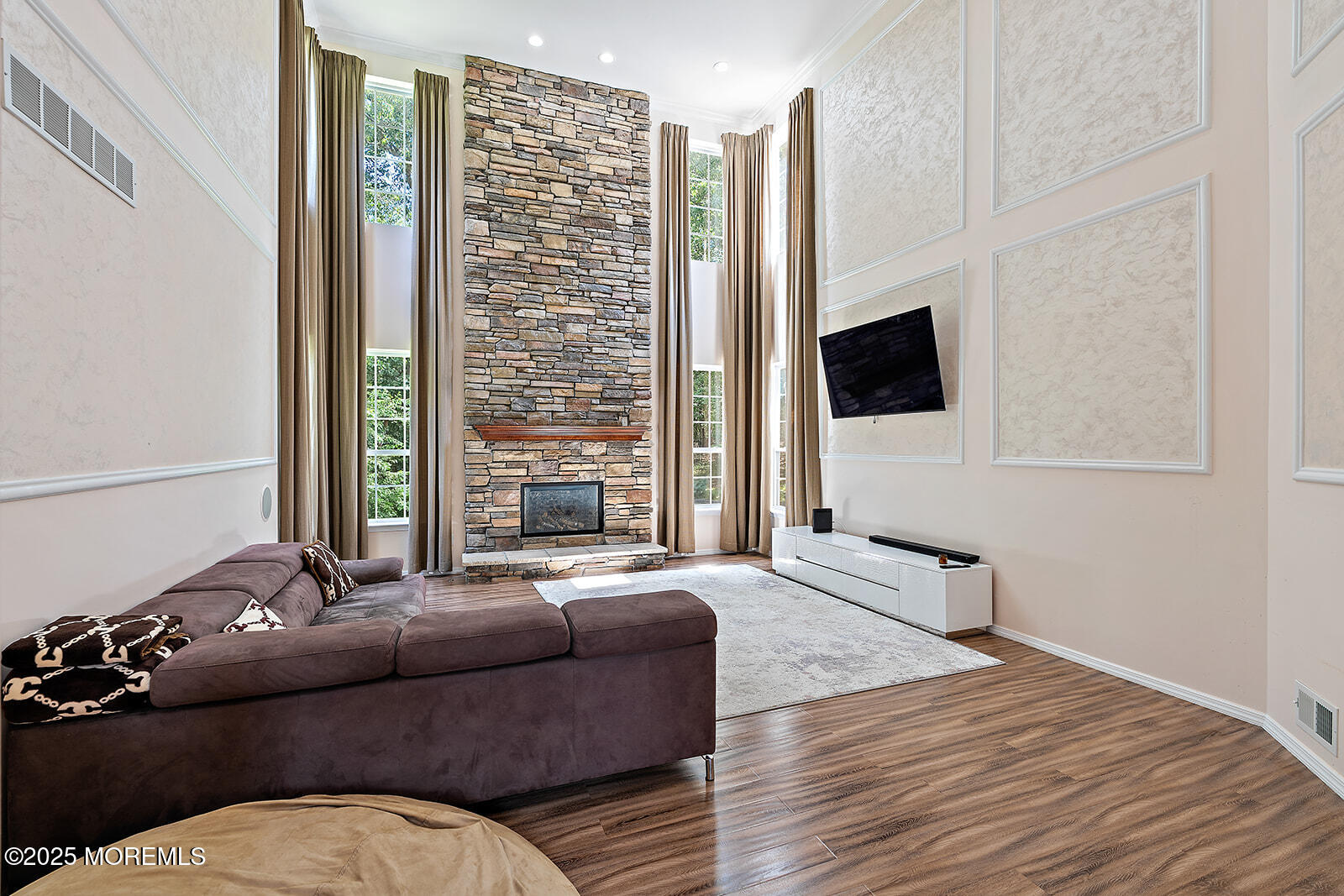 26 Chiswick Court Jackson, NJ 08527 - Photo 3 of 41 a living room with furniture fireplace and flat screen tv