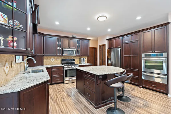 a kitchen with granite countertop lots of counter top space