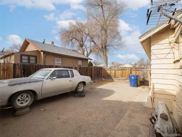 a view of a car parked in front of a house