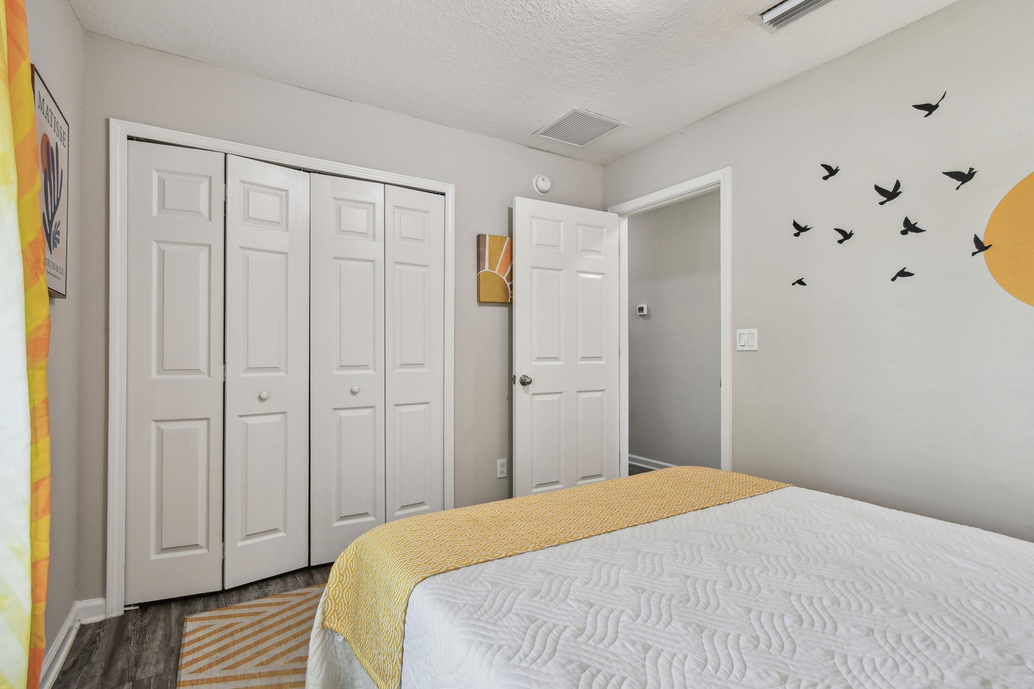 241 Columbus Street St. Augustine, FL 32084 - Photo 17 of 47 a bedroom with a bed and cabinets